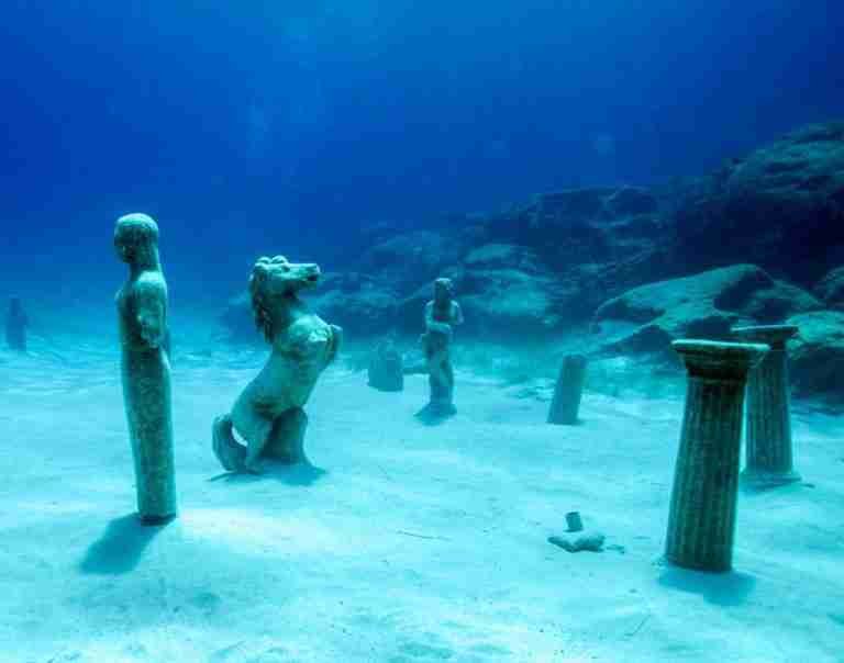 Under water dive spot with some statues in Protaras green bay